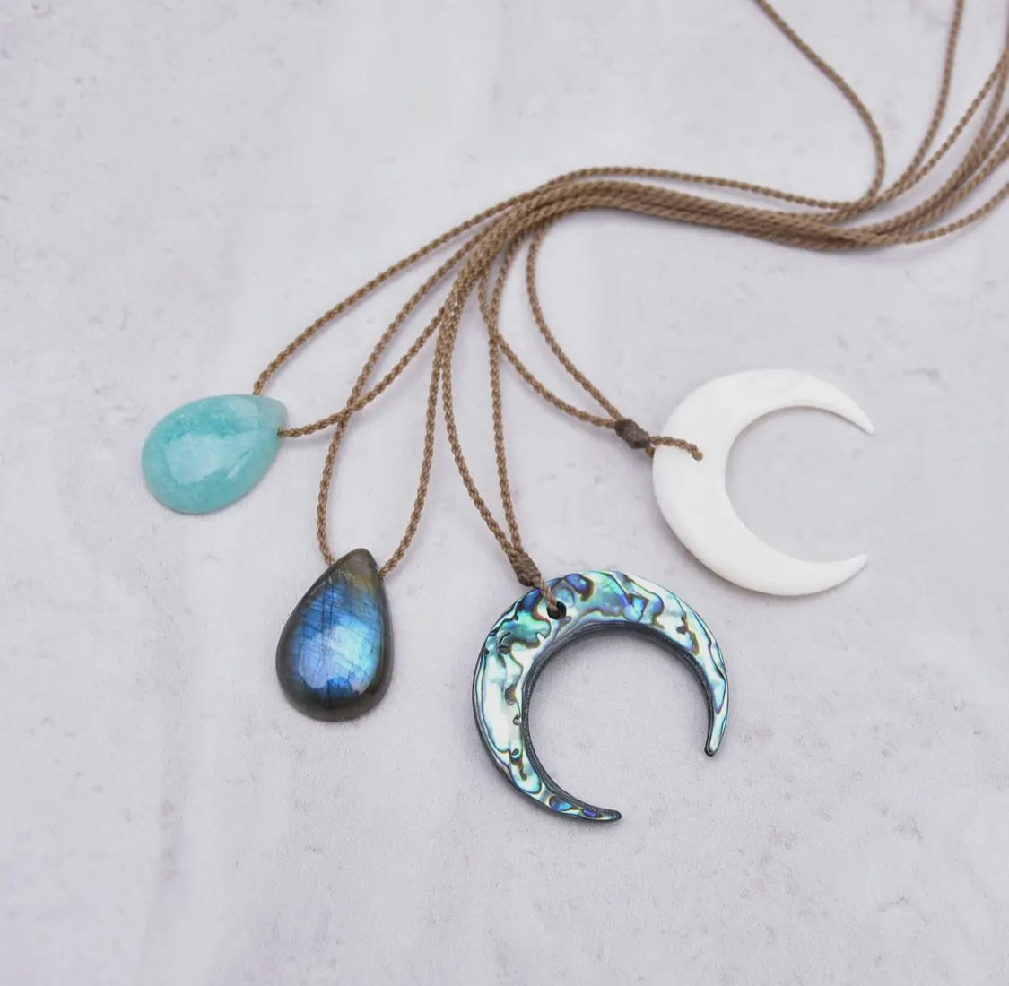 Crescent pendant necklaces